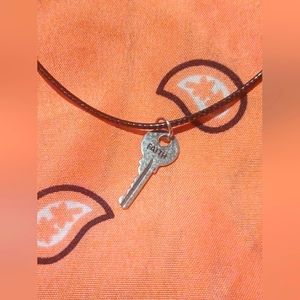 Black cord necklace with key charm
